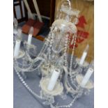 A LATE GEORGIAN STYLE SIX LIGHT CRYSTAL CHANDELIER. W.60 x H.55cms.