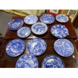 A COLLECTION OF TWELVE ANTIQUE BLUE AND WHITE TRANSFER PRINTED POTTERY PLATES OF VARIOUS PATTERNS TO