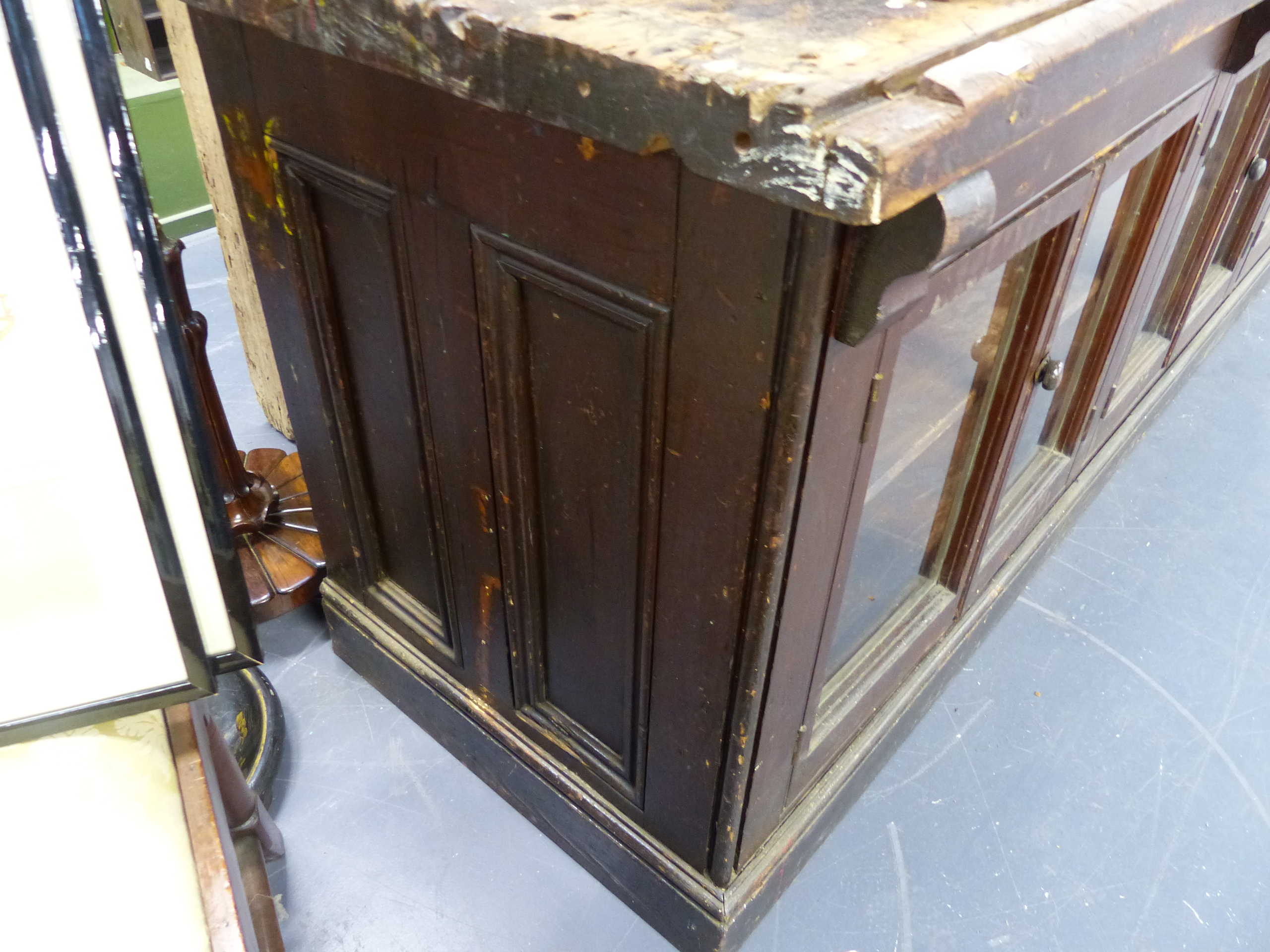 AN ANTIQUE PINE SHOP COUNTER WITH SIX GLAZED PANEL DOORS ENCLOSING SHELVES. W.244 x D.68 x H.83cms. - Image 3 of 16