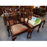 A SET OF SIX MID GEORGIAN STYLE MAHOGANY DINING CHAIRS ON CABRIOLE LEGS AND CLAW AND BALL FEET.