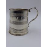A GEORGIAN SILVER HALLMARKED CHRISTENING TANKARD, DATED 1815 LONDON, APPROXIMATE HEIGHT 7.5cms,