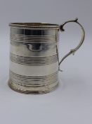 A GEORGIAN SILVER HALLMARKED CHRISTENING TANKARD, DATED 1815 LONDON, APPROXIMATE HEIGHT 7.5cms,