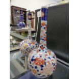 A PAIR OF JAPANESE IMARI BOTTLE FORM VASES. H.25cms.