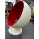 A LARGE MID CENTURY BALL CHAIR.IN THE STYLE OF EERO AARNIO