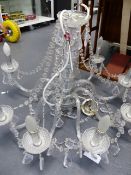 A LATE GEORGIAN STYLE EIGHT LIGHT CRYSTAL CHANDELIER. W.76 x H.55cms.