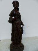 A LATE 19th.C.FRENCH BRONZE FIGURE OF A LADY IN COURTLY DRESS HOLDING A BOOK. H.36cms.