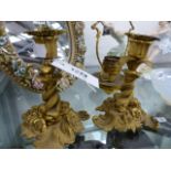 A PAIR OF ORMOLU ENTWINED DOLPHIN FORM SINGLE CANDLESTICKS. H.16cms.