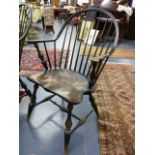 A SET OF EIGHT AMERICAN CONTINUOUS ARM COMB BACK WINDSOR CHAIRS WITH SADDLE SEATS.