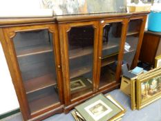 AN ANTIQUE MAHOGANY BREAKFRONT DWARF BOOKCASE WITH FOUR GLAZED PANEL DOORS. W.214 x H.129cms.