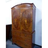 A GOOD REGENCY MAHOGANY AND INLAID LINEN PRESS WITH SWAG BURN DECORATION. W.122 x H.225cms.