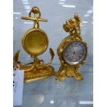 A VICTORIAN GILT METAL FRENCH STYLE WATCH STAND IN THE FORM OF AN ANCHOR TOGETHER WITH A MINIATURE
