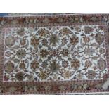 A FINELY WOVEN PART SILK PERSIAN RUG. 123 x 78cms.
