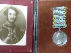 A VICTORIAN CRIMEA MEDAL WITH FOUR BARS, SEBASTAPOL, INKERMAN, BALAKLAVA & ALMA. NAMED TO CAPT. E.