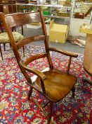 A LARGE VICTORIAN LADDER BACK KITCHEN ARMCHAIR.