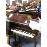 A GOOD QUALITY BABY GRAND PIANO BY MONINGTON. W.137 x L.140.