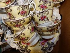 A VICTORIAN POTTERY PART TEA SET WITH FLORAL DECORATION TO INCLUDE CUPS AND SAUCERS, SIDE PLATES,