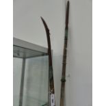 TWO JAPANESE POLEARMS, A NAGINATA WITH CURVED HEAVY TIPPED BLADE AND EBONISED EBU AND BRASS MOUNTS