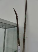 TWO JAPANESE POLEARMS, A NAGINATA WITH CURVED HEAVY TIPPED BLADE AND EBONISED EBU AND BRASS MOUNTS