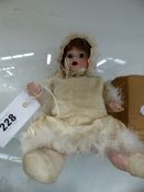 A SMALL GERMAN BISQUE HEAD DOLL, THE HEAD IMPRESSED 435.1 GERMANY.