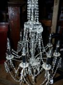 A LATE GEORGIAN STYLE EIGHT LIGHT CHANDELIER. W.66 x H.176cms.