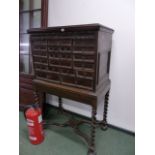 AN EARLY 19th.C.CONTINENTAL WALNUT MULTII DRAWER CHEST RAISED ON BARLEY TWIST SUPPORTS WITH SHAPED X