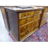 A 17th/18th.C. OAK AND WALNUT CHEST OF TWO SHORT AND THREE LONG DRAWERS STANDING ON LATER BUN