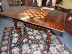 A WM.IV.ROSEWOOD GAMES TABLE WITH CHESS BOARD INLAID FOLD OVER TOP AND FRIEZE DRAWER.