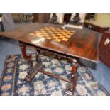 A WM.IV.ROSEWOOD GAMES TABLE WITH CHESS BOARD INLAID FOLD OVER TOP AND FRIEZE DRAWER.