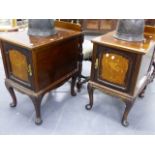 A PAIR OF MAHOGANY AND INLAID SIDE CABINETS WITH PANELLED DOORS ON CABRIOLE LEGS.