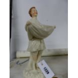 A PORCELAIN FIGURINE.