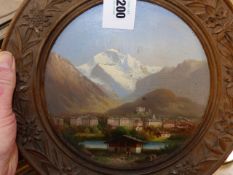 MID 19th.C.SWISS/AUSTRIAN SCHOOL. A VILLAGE IN THE ALPS, OIL ON CARVED CIRCULAR PANEL SIGNED