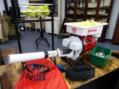 A GOOD LOBSTER TENNIS BALL PRACTICE LAUNCHER IN NEAR NEW CONDITION COMPLETE WITH CABLE AND