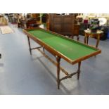 AN ANTIQUE BAGATELLE BOARD ON ORIGINAL DEMOUNTABLE STAND.