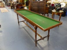 AN ANTIQUE BAGATELLE BOARD ON ORIGINAL DEMOUNTABLE STAND.