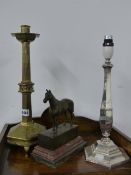 A VICTORIAN GOTHIC BRASS CANDLESTICK, A SILVERPLATED TABLE LAMP AND A BRONZE FIGURE OF A HORSE.