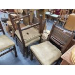 A SET OF FOUR OAK DINING CHAIRS.
