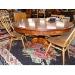 A VICTORIAN MAHOGANY TILT TOP BREAKFAST TABLE ON CARVED TRIPOD SUPPORTS.