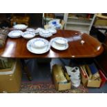 A REGENCY STYLE MAHOGANY DINING TABLE.