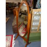 A MAHOGANY CHEVAL MIRROR.