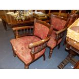 A PAIR OF VICTORIAN OAK DESK ARMCHAIRS.