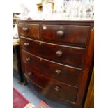 A VICTORIAN MAHOGANY BOW FRONT CHEST OF DRAWERS.