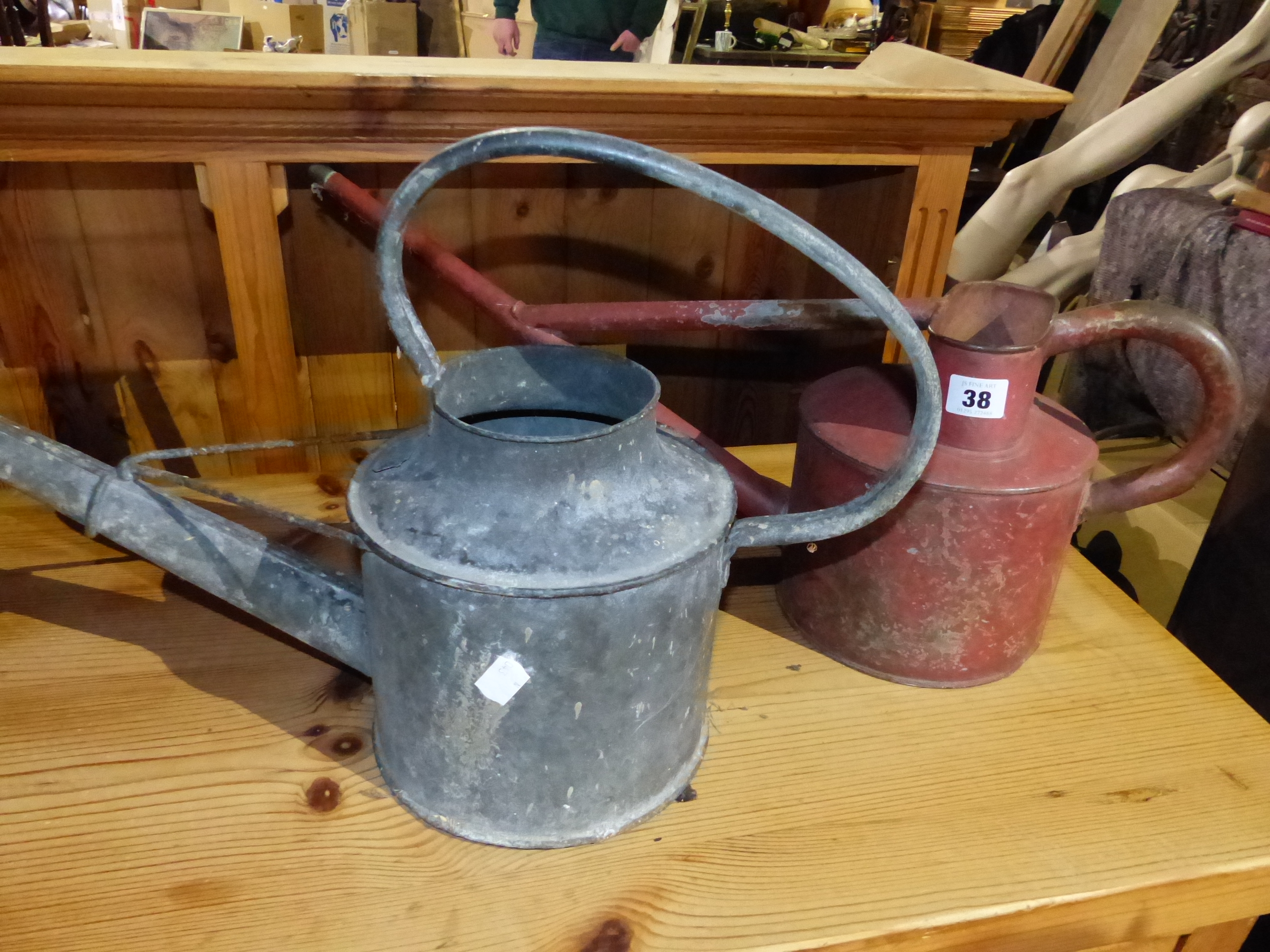 TWO VINTAGE WATERING CANS.