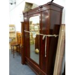 AN EDWARDIAN MAHOGANY INLAID WARDROBE.