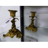 A PAIR OF GILT BRONZE CANDLESTICKS.