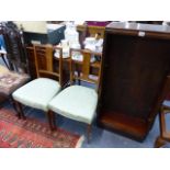 A PAIR OF EDWARDIAN INLAID BEDROOM CHAIRS AND A SMALL BOOKCASE.