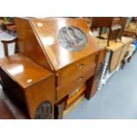 A CARVED HARDWOOD WRITING BUREAU.