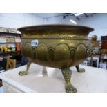 AN ANTIQUE BRASS JARDINIERE.