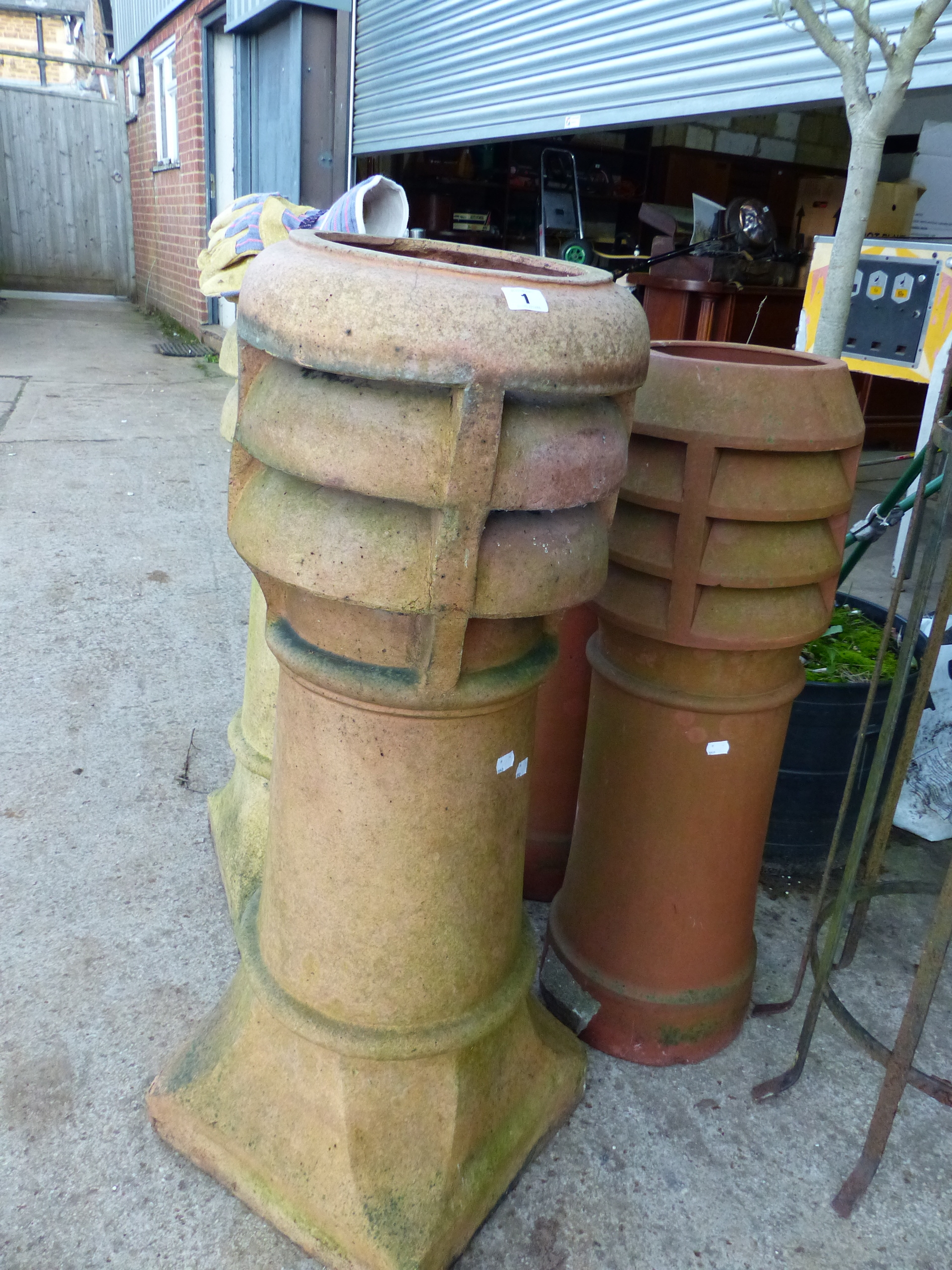 FIVE VARIOUS CHINMNEY POTS.