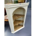 A PAINTED PINE CORNER CABINET.