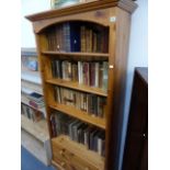 A MODERN PINE BOOKCASE AND AN OAK OPEN FRONT BOOKCASE.